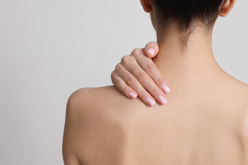 Canvas Print - Back view of woman with perfect smooth skin on light background, closeup