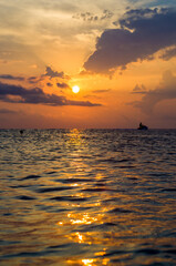 Wall Mural - Amazing sea sunset, the sun, waves, clouds