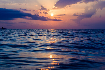 Wall Mural - Amazing sea sunset, the sun, waves, clouds