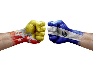 Two hands punch to each others on white background. Country flags painted fists, conflict crisis concept between bhutan and el salvador