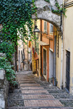 Fototapeta Uliczki - A typical uphill alley of the old town, called 