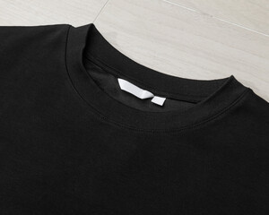 Wall Mural - Blank Black Oversized T-shirt mockup template on the floor.