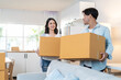 © Kawee - Asian young happy new marriage couple moving to new house together.