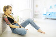 © alexkich - The girl is resting in the loft. Young stylish girl posing in the bathroom.