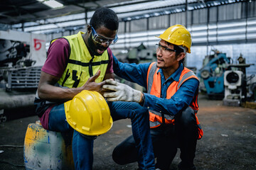 The worker suffered a finger injury, First aid support accident in the factory, Occupational Accidents, Safety first concept.