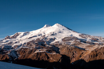 Wall Mural - Amazing snowy mountain landscape of the Caucasus, peaks of mount Elbrus on a clear blue sky day