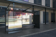 Contemporary glass bus stop with city reflections and daylight. Transport and urban concept. 3D Rendering.