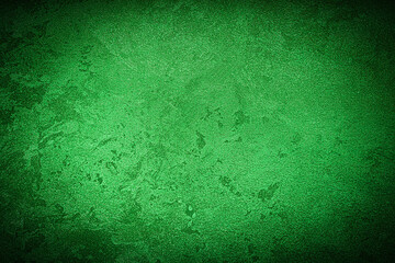 Texture of green decorative plaster or concrete with vignette.