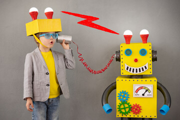 Poster - Happy child playing with robot