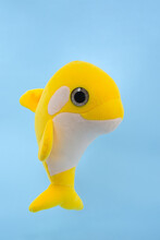 Soft Children's Toy - Yellow Dolphin On A Blue Background