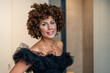 © ADDICTIVE STOCK - Elegant woman looking at camera with smile
