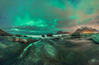 © ADDICTIVE STOCK - Scenic landscape of aurora over rocky seashore in Norway