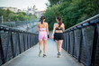 © luisrojasstock - pair of young women walking in sportswear