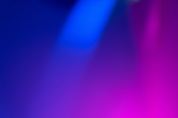 Defocused color light. Neon glow overlay. Fluorescent led rays. Blur blue magenta pink holographic flecks on dark abstract copy space background.