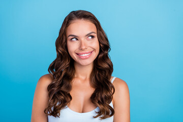 Canvas Print - Photo of optimistic brunette hairdo lady look empty space wear teal top isolated on blue color background