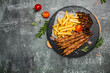 Bbq meat on wooden skewers with fries and vegetables, Georgian cuisine. hearty lunch or dinner, banner, menu, recipe place for text, top view