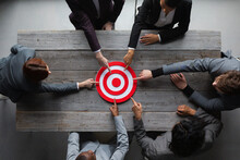 Business People Pointing At Red Target