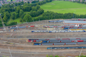 Wall Mural - Aerial Photo of a train station works depot with lots of trains in the tracks located in the village of Halton Moor in Leeds, West Yorkshire in the UK on a bright sunny summers day.