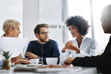 Poster - Success happens when a great team comes together. Shot of a group of businesspeople sitting together in a meeting.