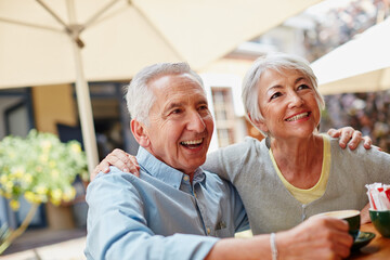 Sticker - The golden years are going great. Shot of a senior couple having coffee at a cafe.