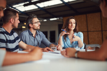 Aufkleber - Sharing new ideas. Shot of a group of coworkers having a meeting in an open plan office.