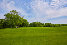 View Of Golf Course With Beautiful Green Field.