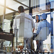 © Ruan J/peopleimages.com - Meeting behind class walls. Shot of a group of young woman giving a presentation to colleagues in a boardroom.