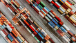Aerial view of shipping container port terminal. Colourful pattern of containers in harbor. Maritime logistics global inport export trade transportation.
