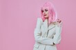 Young woman in White blazer pink hair Glamor Cosmetics pink background unaltered
