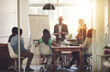 © Yuri Arcurs/peopleimages.com - Any questions. Shot of a group of coworkers in a boardroom meeting.