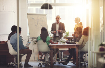 Canvas Print - Any questions. Shot of a group of coworkers in a boardroom meeting.