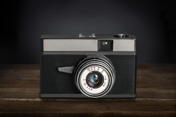 Wall Mural - Classic vintage Camera on the wooden desk