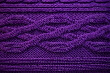 A Photograph Of A Violet Sweater With A Distinct Structure