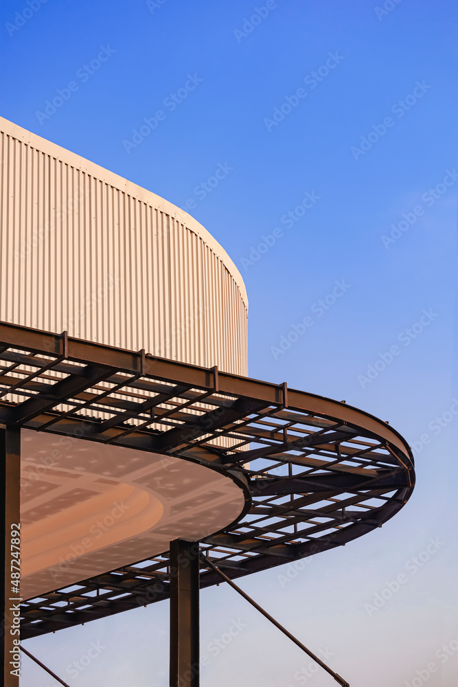 Curved metal awning structure with corrugated steel roof of modern ...