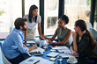 © Ruan Jordaan/peopleimages.com - Shes bringing new ideas to the team. Shot of a group of businesspeople having a meeting in a boardroom.