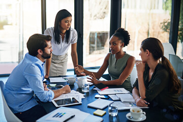 Aufkleber - Shes bringing new ideas to the team. Shot of a group of businesspeople having a meeting in a boardroom.