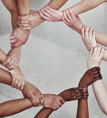 Sticker - The greatest support network. Shot of a group of hands holding on to each other.