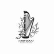 © Mashoid Studio - Harp logo vector, vintage harp musical illustration, orchestra icon, floral harp logo