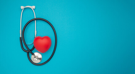 A red heart shape with a stethoscope on a blue background