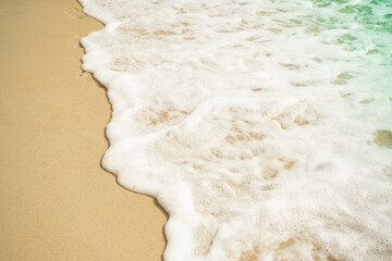 Soft wave on sand beach at coast with blue sea ocean tropical nature. tourism vacation travel summer in holidays. white texture wallpaper island flat lay.