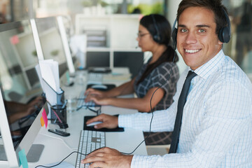 Aufkleber - His expertise makes for an excellent customer service experience. Portrait of a happy and confident young man working in a call center.