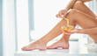 Avoid the stress of shaving. Cropped shot of an unrecognizable woman applying wax to her legs in the bathroom at home.