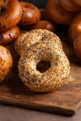 Wall Mural -  Variety of Different Flavored Bagels on a Wood Table