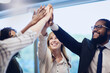 © Adene Sanchez/peopleimages.com - We did it, together. Low angle shot of a group of young businesspeople high fiving in celebration while standing in their office.