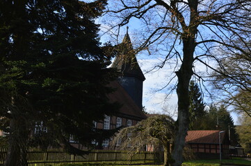 Sticker - Historische Kirche im Winter im Dorf Ostenholz, Niedersachsen