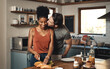 © Allistair F/peopleimages.com - Theres no way Im skipping breakfast with you. Shot of a man kissing his wife while she prepares breakfast in the kitchen at home.