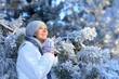 © aletia2011 - happy young woman posing in snowy winter park