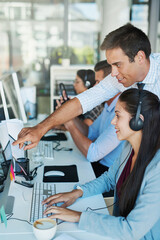 Poster - Settling into her new job with help from her manager. Shot of a young man assisting his colleague in a call center.