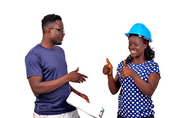 Wall Mural - two young construction engineers working on a project together.