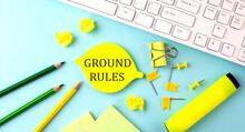 Text Sign Showing GROUND RULES With Office Tools And Keyboard On The Blue Background